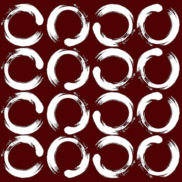 A pattern circles of white circles drawn with a brush in a smooth arrangement with the holes of the circle visible. Loading pen ink circle on brown background